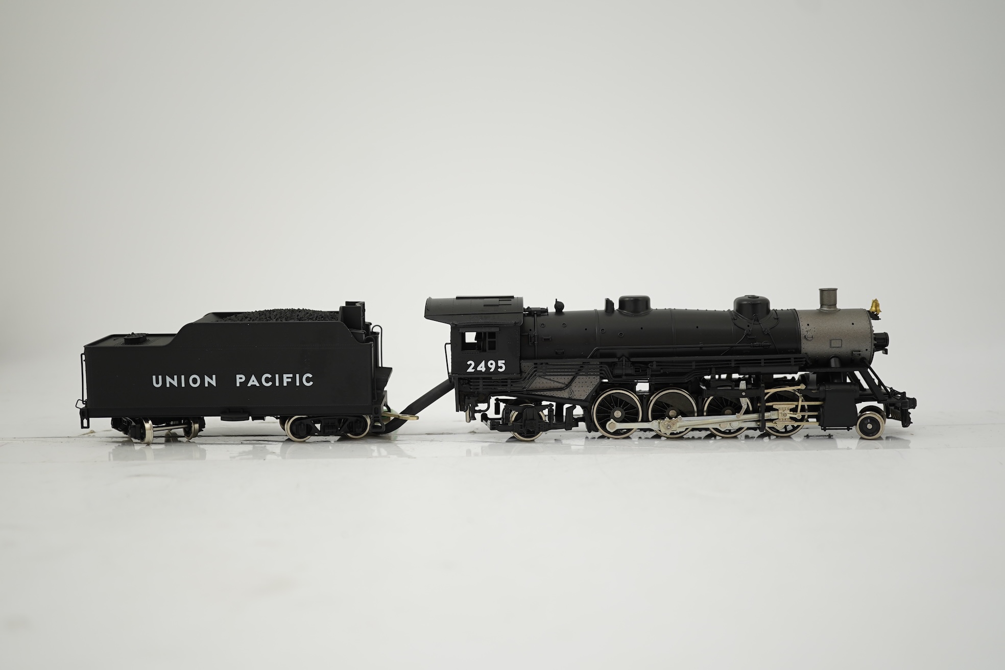 Two boxed HO gauge Union Pacific locomotives; a Genesis (G9008) model of USRA, 2495, 2-8-2 locomotive with bogie tender, together with a Mantua (313-003) 2-6-0 Mogul locomotive with bogie tender, both powered for two rai